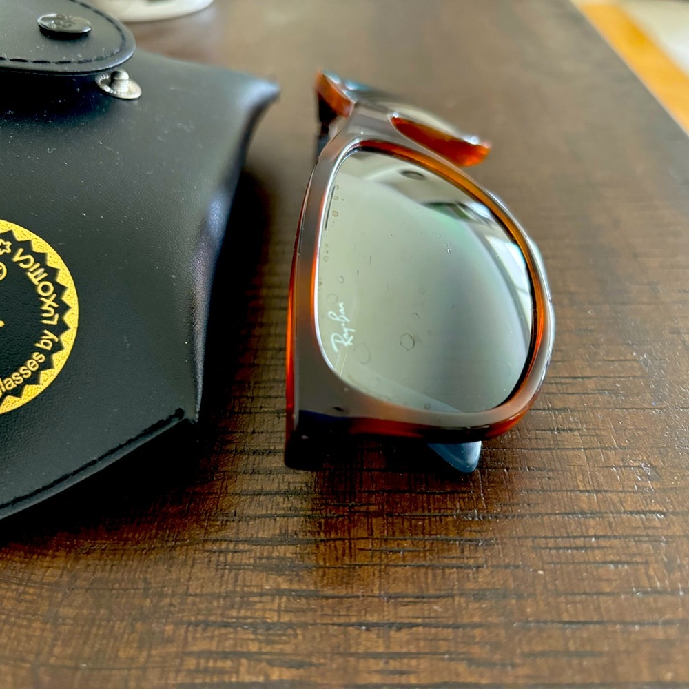 - Ray-Ban sunglasses slightly used.  Excellent condition!  Unisex style